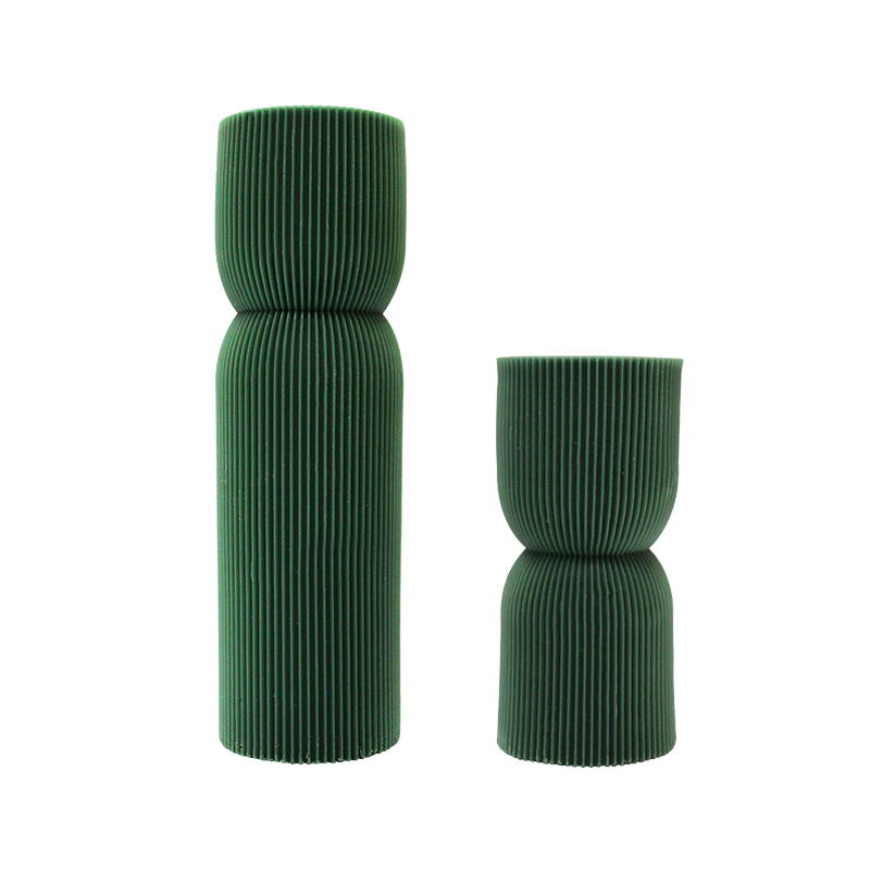 Dark green striped symmetrical pillar candle